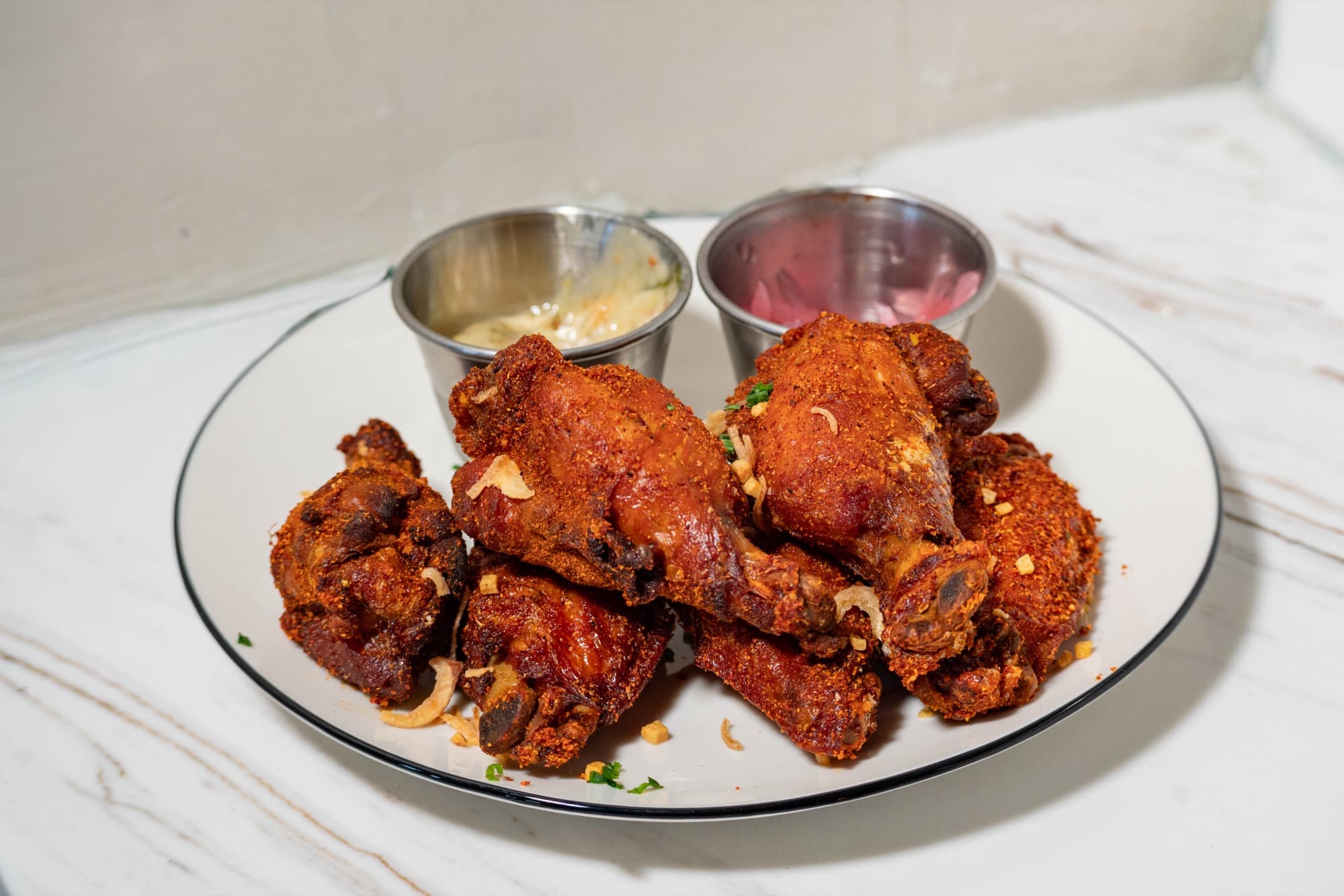 Sulod Wings with calamansi ranch and pickled onions
