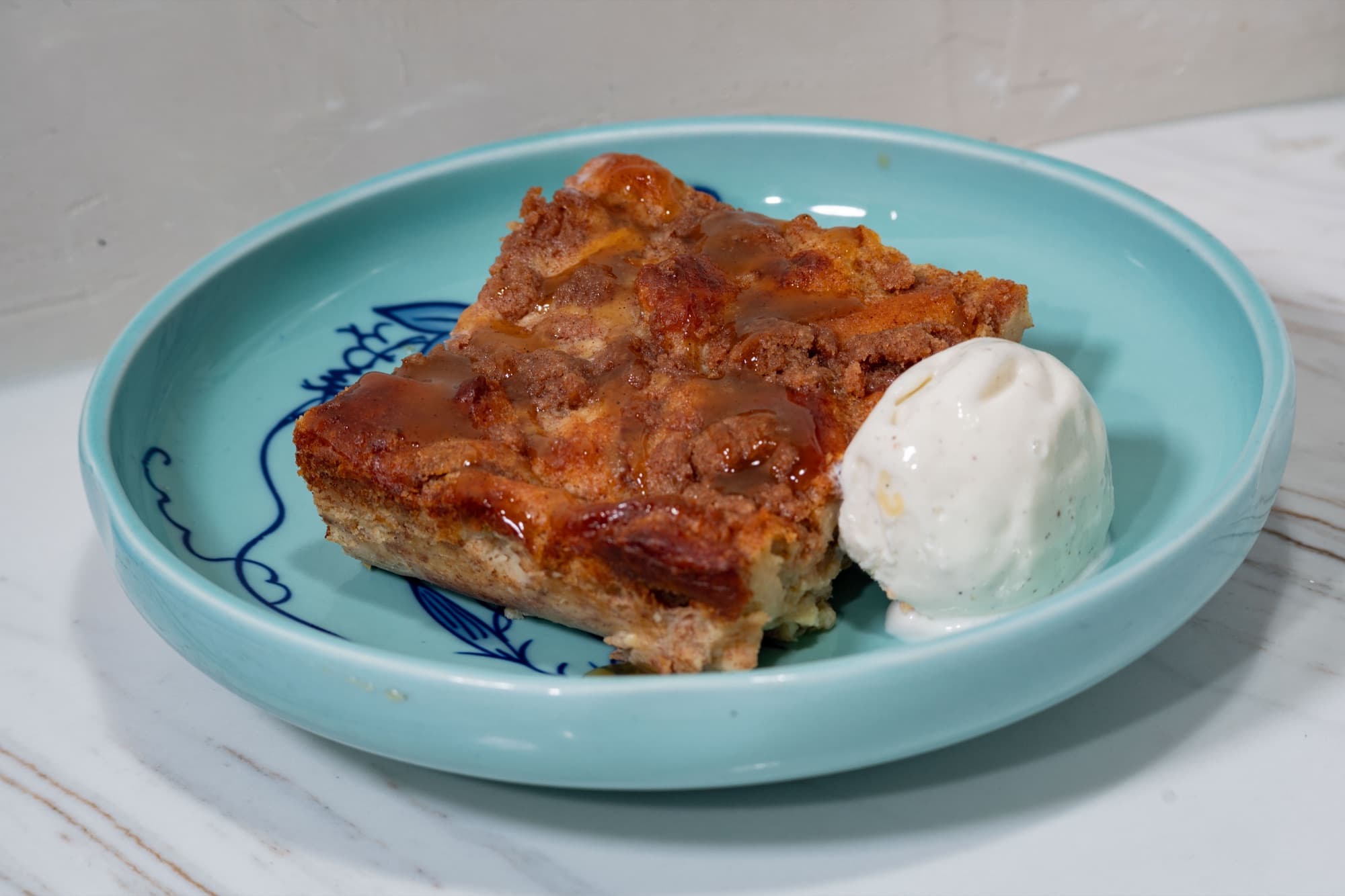 Peach cobbler bread pudding with vanilla bean ice cream