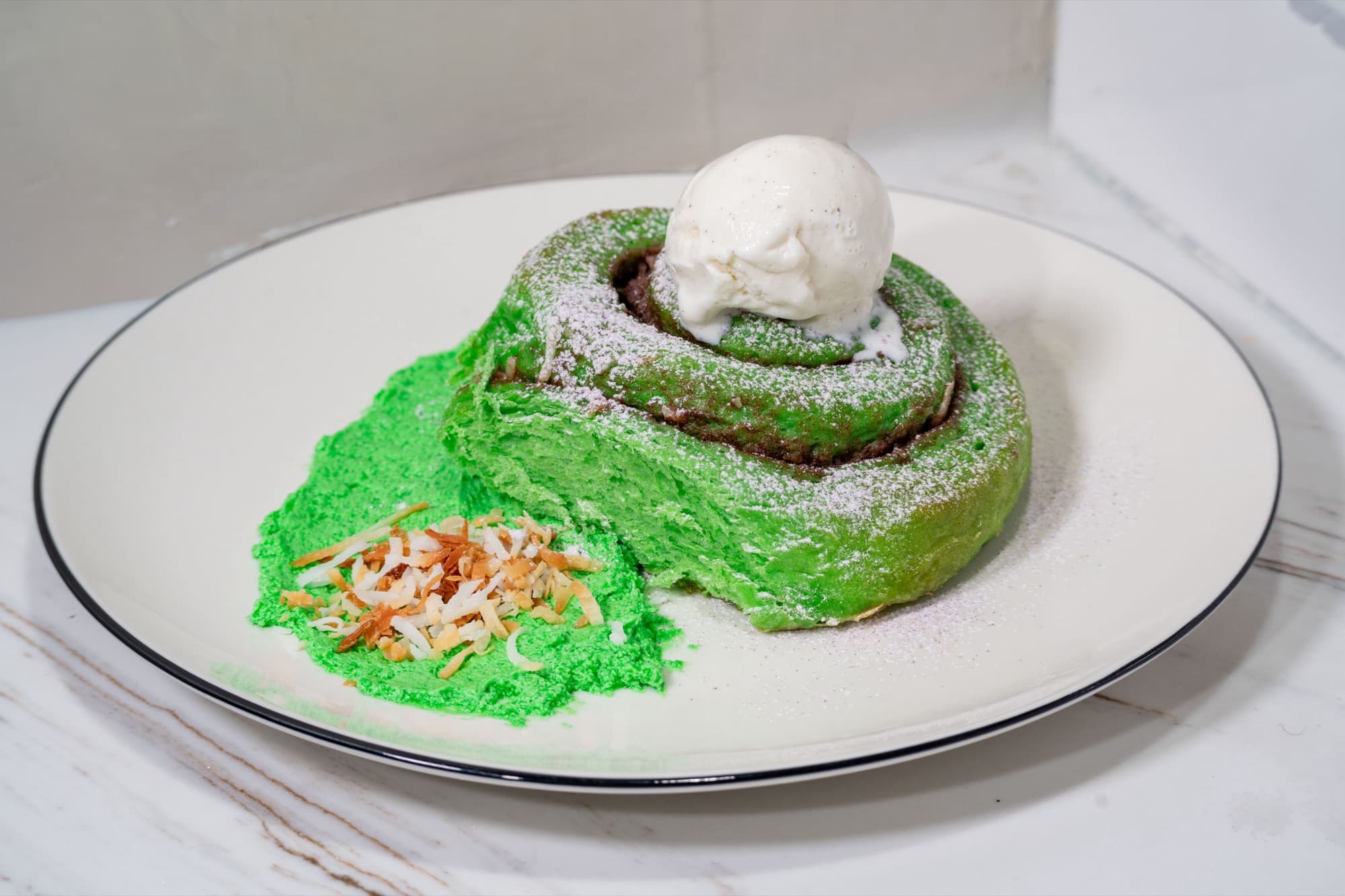 The pandan cinnamon roll with vanilla ice cream